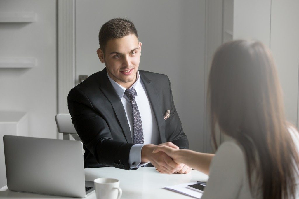 man shaking the hand of a client
