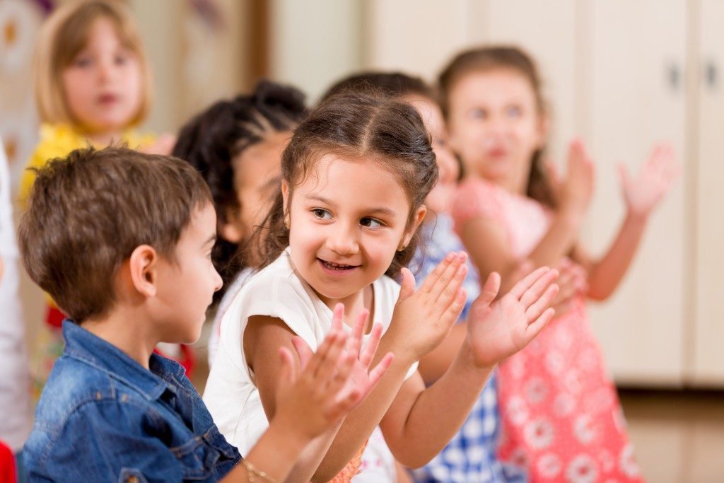 Children clapping