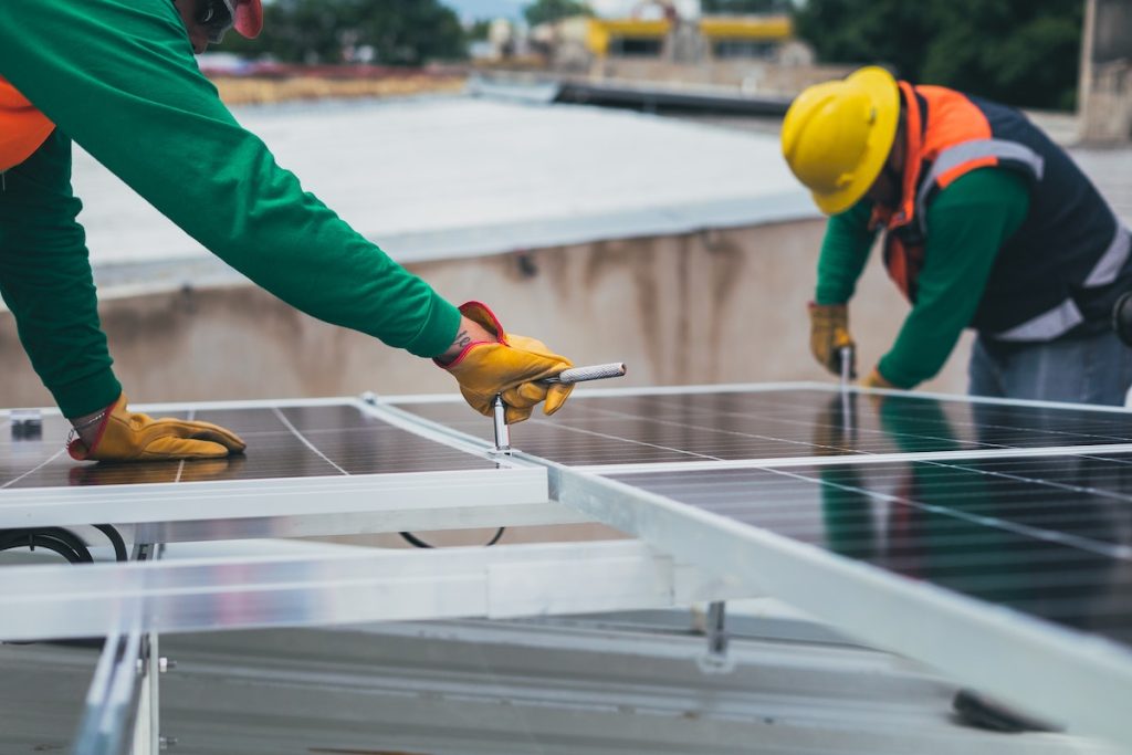 electricians installing solar panels